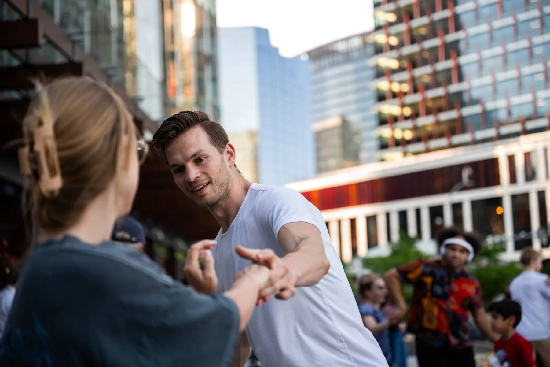 A dancer smiling at his partner during the social dancing at the 2026 Bellevue City Hall event.